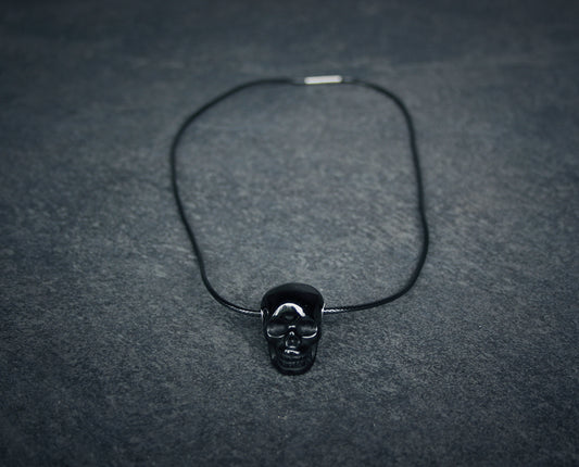 Human skull in shiny obsidian - NECKLACE