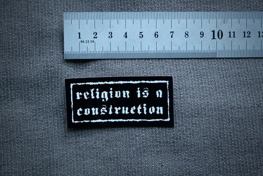 Religion is a construction - vinyl STICKER